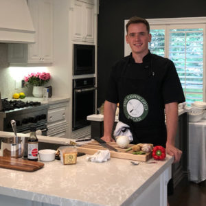 Jack Middleton posing in kitchen with vegan friendly foods